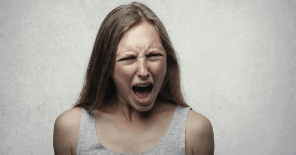 Vyvanse Withdrawal: Woman experiencing intense frustration and anger, showcasing symptoms of Vyvanse withdrawal.